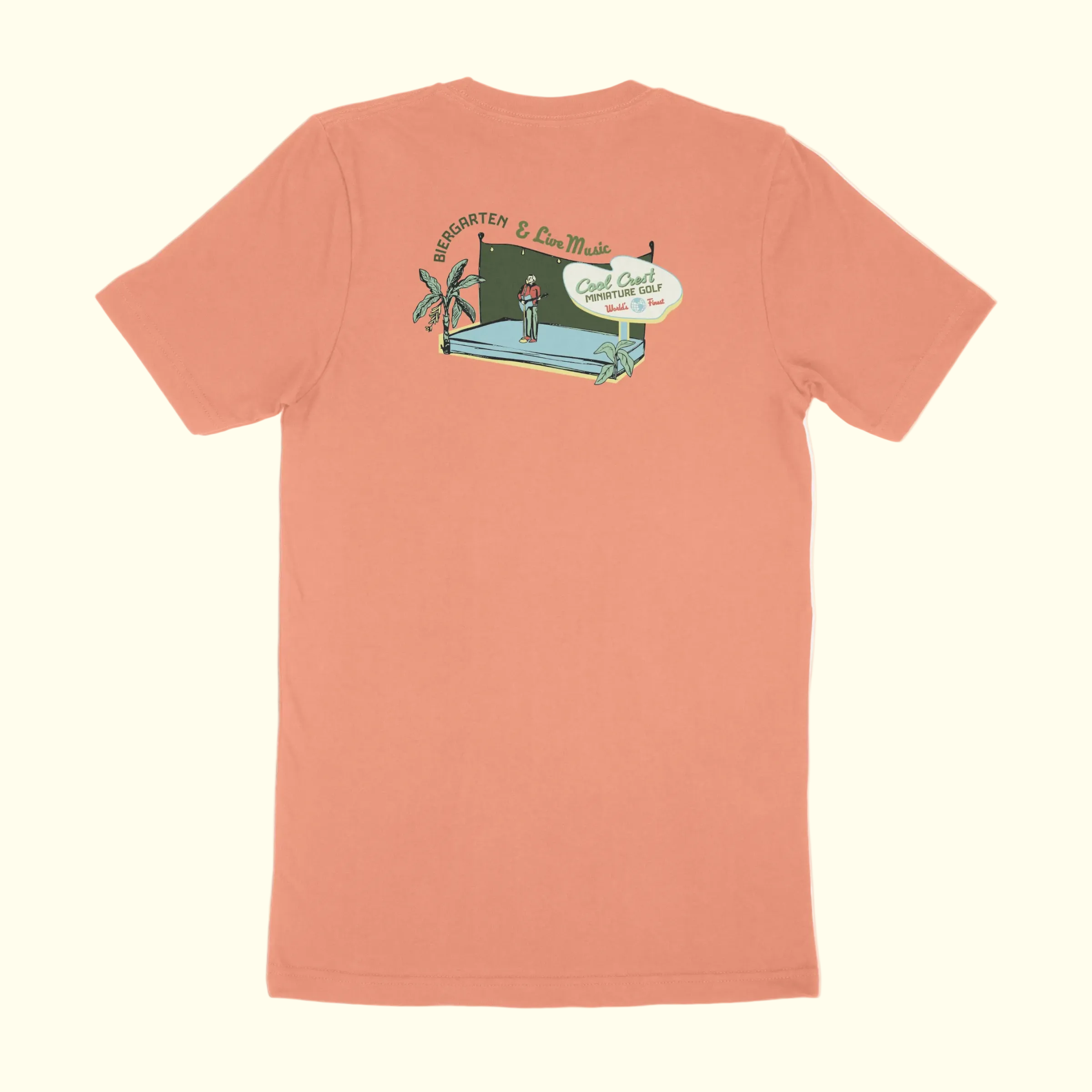 Peach-colored t-shirt with a graphic design on the back against a white background